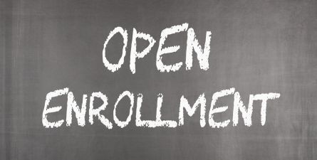 Gray chalkboard, white text: Open Enrollment