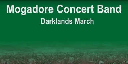 White text: Mogadore Concert Band Darklands March, Green background